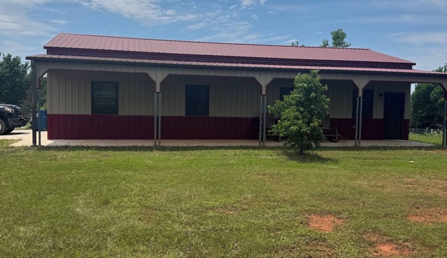 Secluded cottage on 8 acres at Bell Cow Lake. Come let your cares slip away!