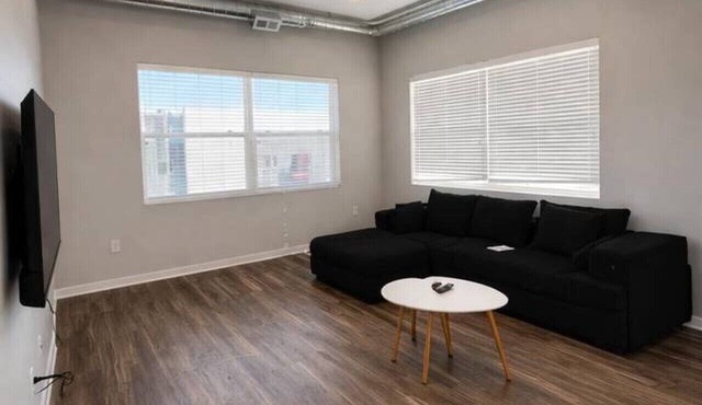 Sleek Black-and-White 2BR with Gym, WiFi & Free Parking