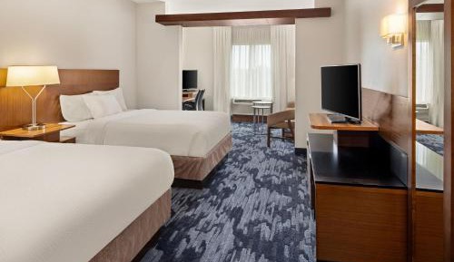 Queen Suite with Two Queen Beds, Sitting Area and Sofa Bed